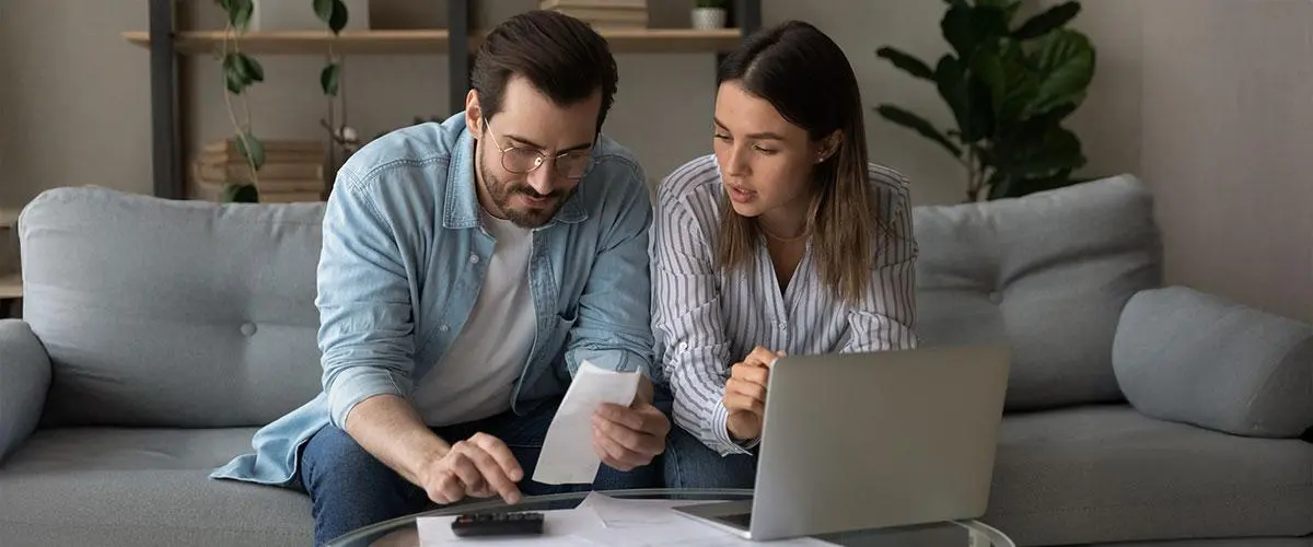 couple reviewing financial documents